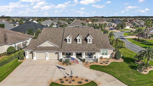 view of front facade featuring a front yard and a garage