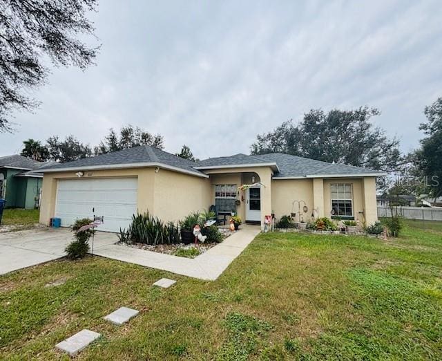 ranch-style home with a front yard and a garage