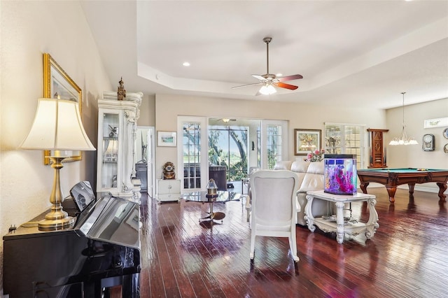 interior space with ceiling fan, a raised ceiling, billiards, and hardwood / wood-style floors