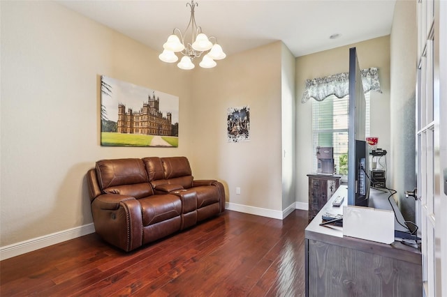 living room with a chandelier and dark hardwood / wood-style floors