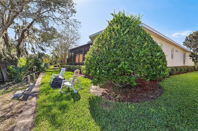 view of yard with a sunroom