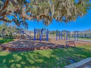 view of jungle gym with a lawn