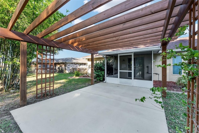 view of patio with a pergola and a sunroom