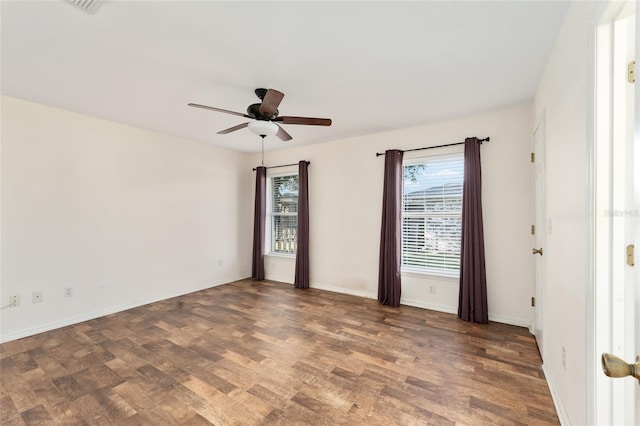 unfurnished room with dark hardwood / wood-style floors and ceiling fan