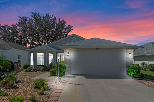 single story home featuring a garage