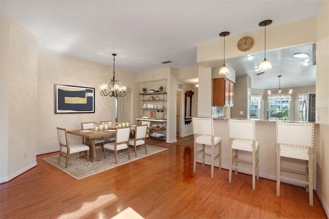 dining area with light hardwood / wood-style floors