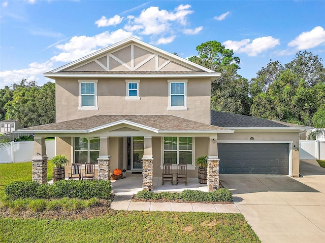 view of front of property featuring a garage and covered porch