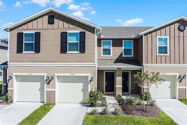 townhome / multi-family property featuring a garage