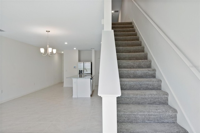 stairway featuring recessed lighting, tile patterned flooring, and a notable chandelier