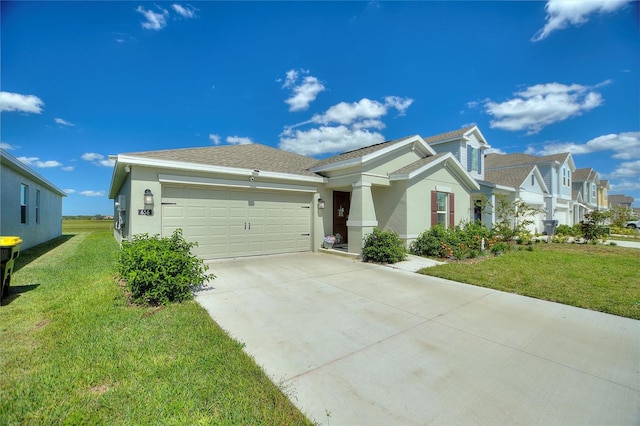 view of front of home with a front yard and a garage