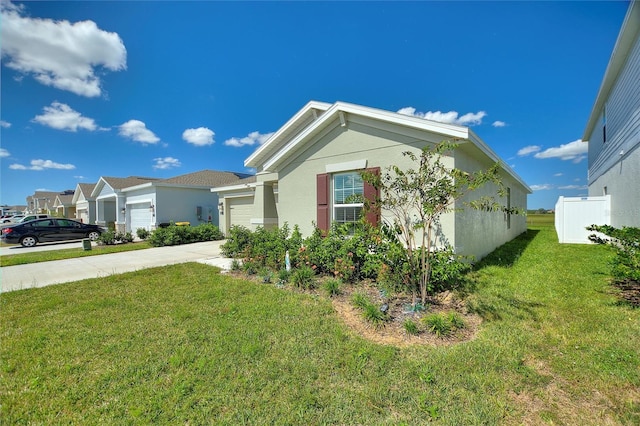 656 Daring Dr, Davenport, FL 33837 - view of property exterior with a garage, a lawn, stucco siding, and concrete driveway