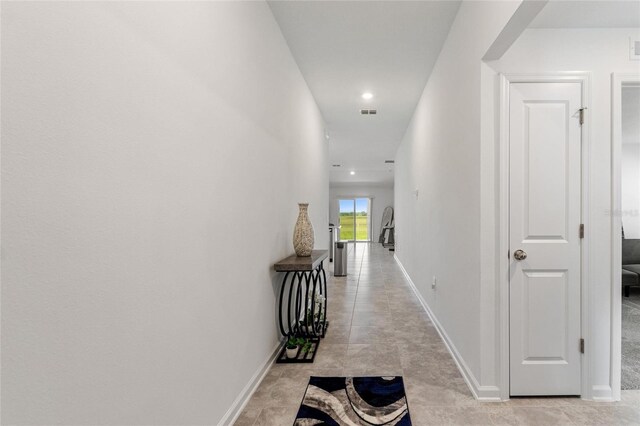 656 Daring Dr, Davenport, FL 33837 - corridor featuring light tile patterned floors, baseboards, and recessed lighting