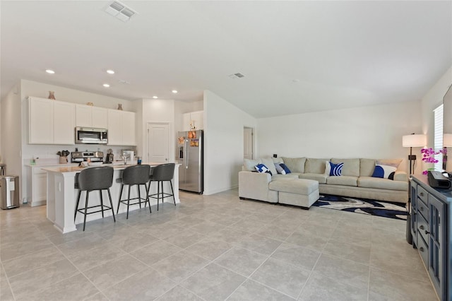 656 Daring Dr, Davenport, FL 33837 - living area featuring recessed lighting, light tile patterned floors, and visible vents