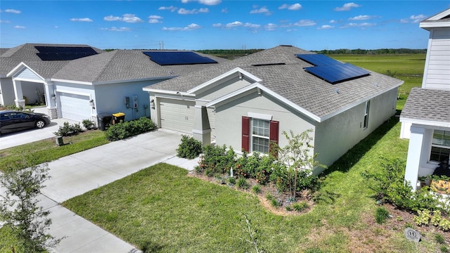 656 Daring Dr, Davenport, FL 33837 - ranch-style home featuring a shingled roof, an attached garage, stucco siding, and a front yard