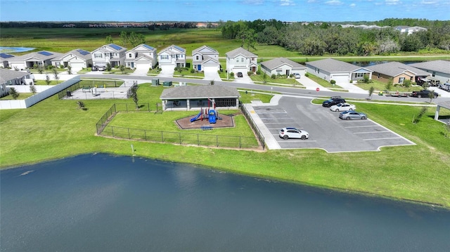 birds eye view of property featuring a water view