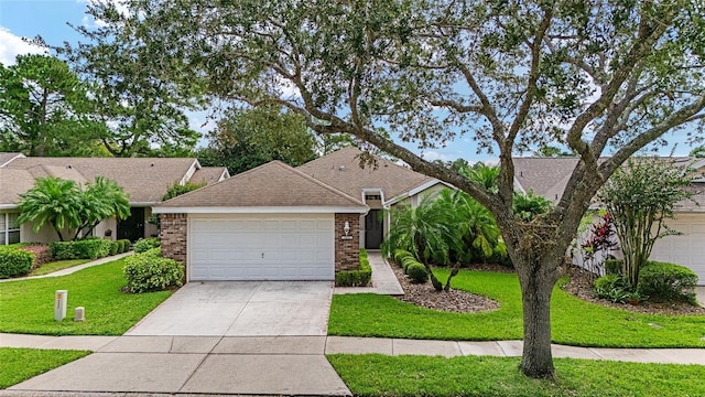 ranch-style home with a front yard and a garage