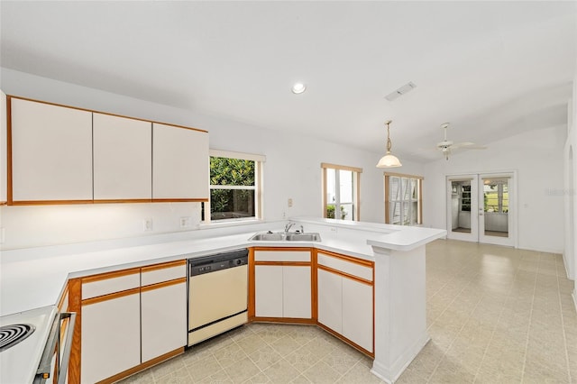 kitchen with white cabinetry, white dishwasher, and kitchen peninsula