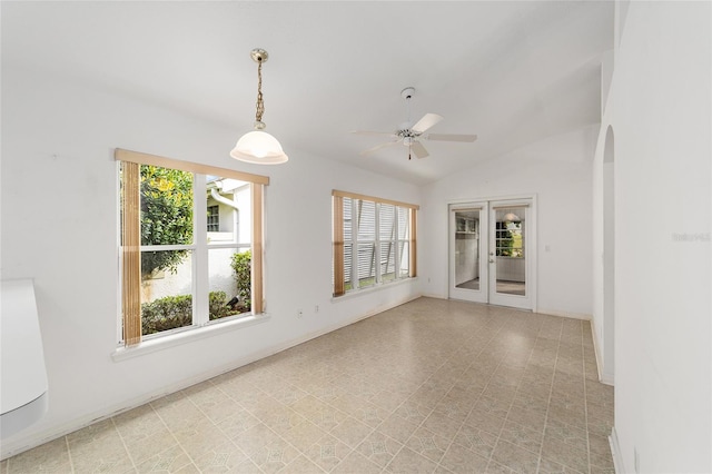 unfurnished room with french doors, vaulted ceiling, and ceiling fan