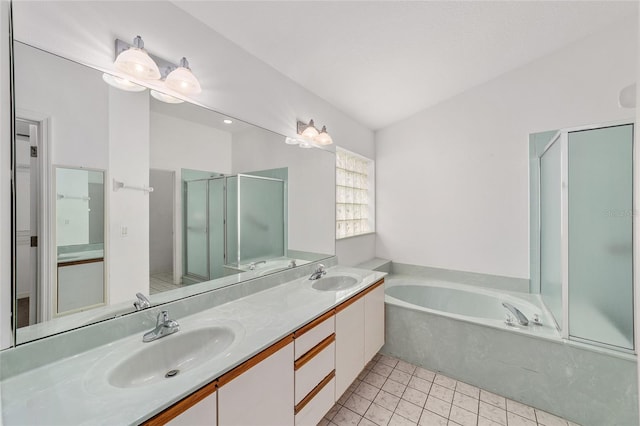 bathroom featuring vanity, tile patterned flooring, separate shower and tub, and vaulted ceiling