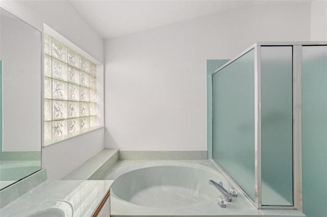 bathroom featuring vanity, lofted ceiling, and plus walk in shower