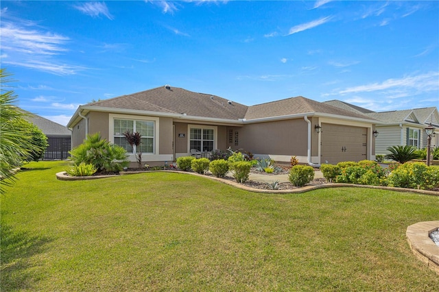 single story home featuring a front lawn and a garage