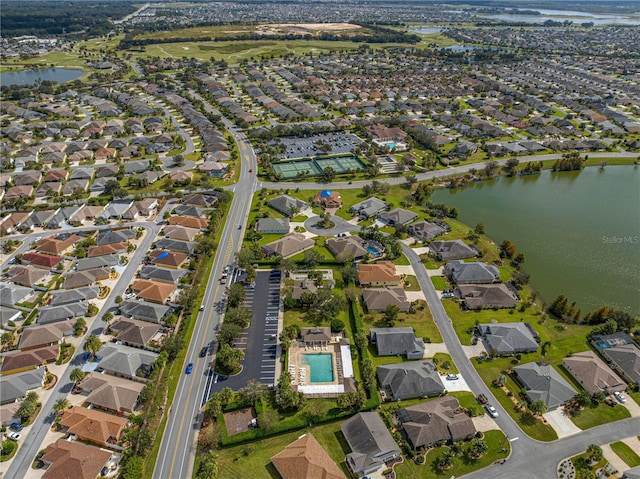 birds eye view of property with a water view