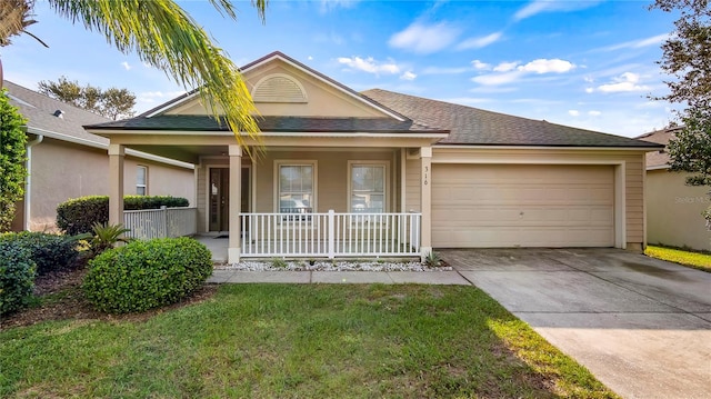 single story home featuring a front lawn, a garage, and a porch