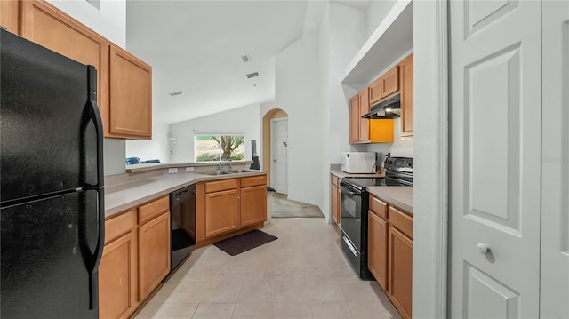 kitchen with light tile patterned floors, sink, black appliances, and lofted ceiling