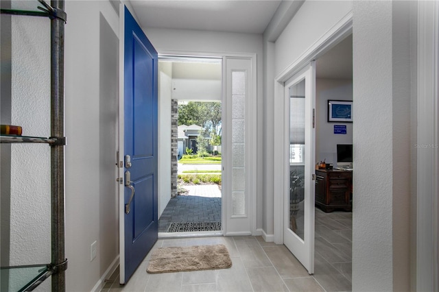 view of tiled foyer entrance