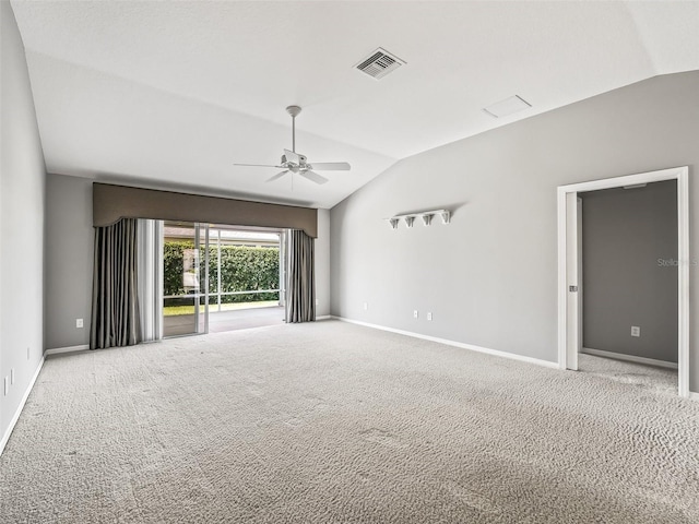 carpeted spare room with lofted ceiling and ceiling fan