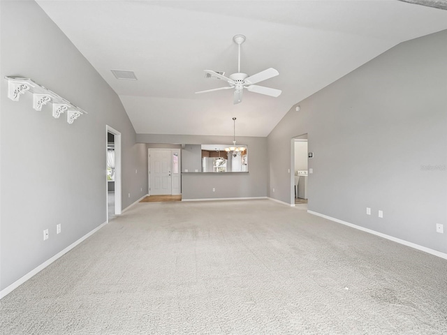 unfurnished living room with light carpet, vaulted ceiling, and ceiling fan with notable chandelier