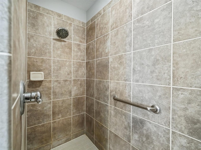 bathroom with tiled shower