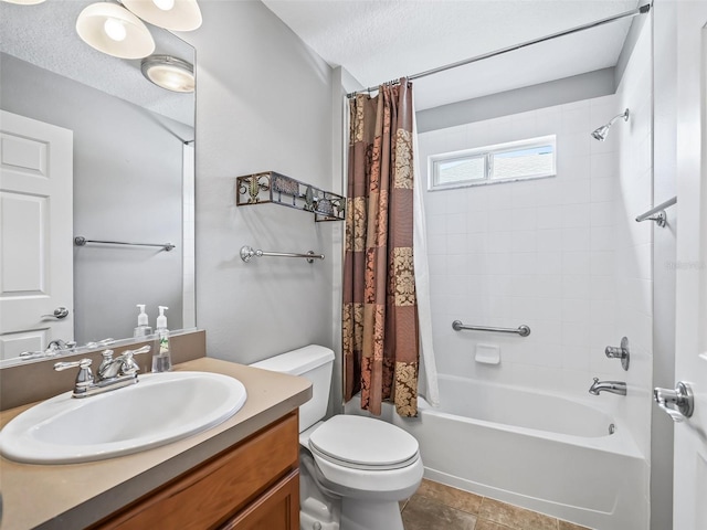 full bathroom with a textured ceiling, shower / bath combo, toilet, vanity, and tile patterned flooring