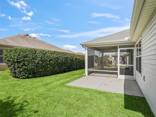 view of yard featuring a patio and a sunroom