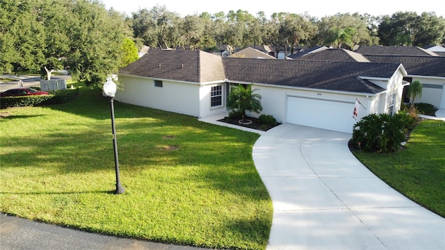 ranch-style house featuring a front lawn and a garage