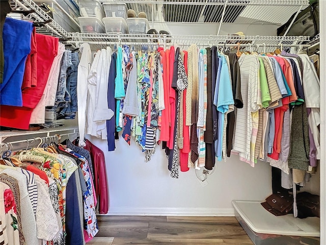 walk in closet featuring hardwood / wood-style floors