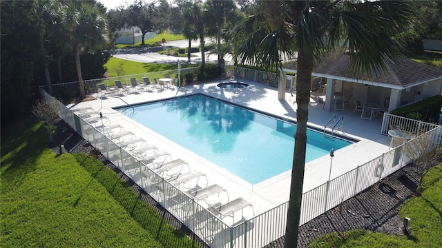 view of swimming pool with a patio area and a lawn