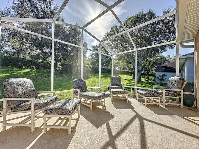 view of patio featuring glass enclosure