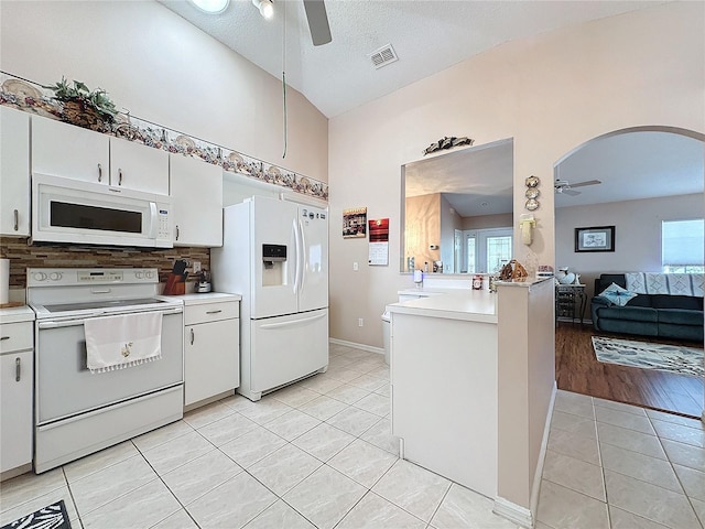 kitchen featuring white cabinetry, ceiling fan, white appliances, and plenty of natural light