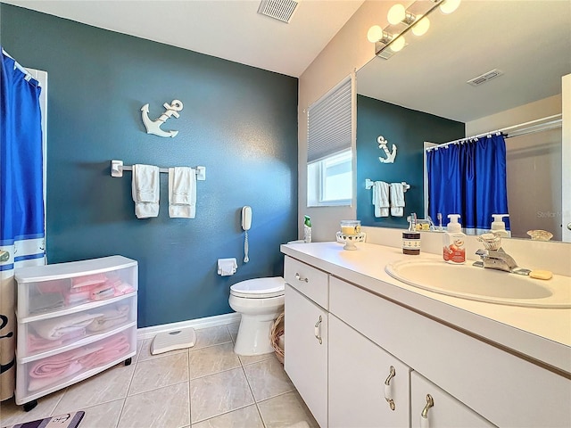 bathroom with vanity, toilet, a shower with curtain, and tile patterned flooring