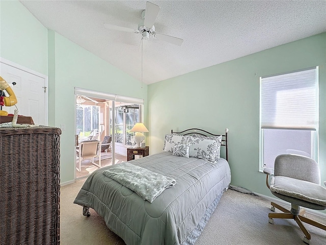 bedroom with ceiling fan, a textured ceiling, vaulted ceiling, and light colored carpet