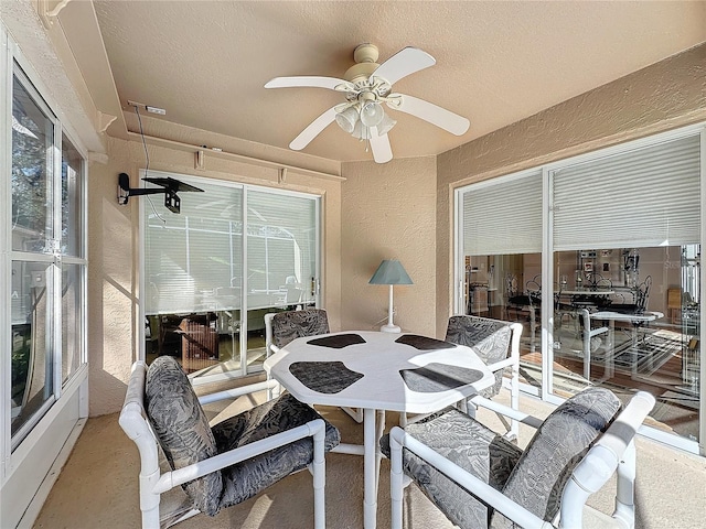 sunroom / solarium with ceiling fan