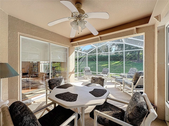 sunroom / solarium with ceiling fan