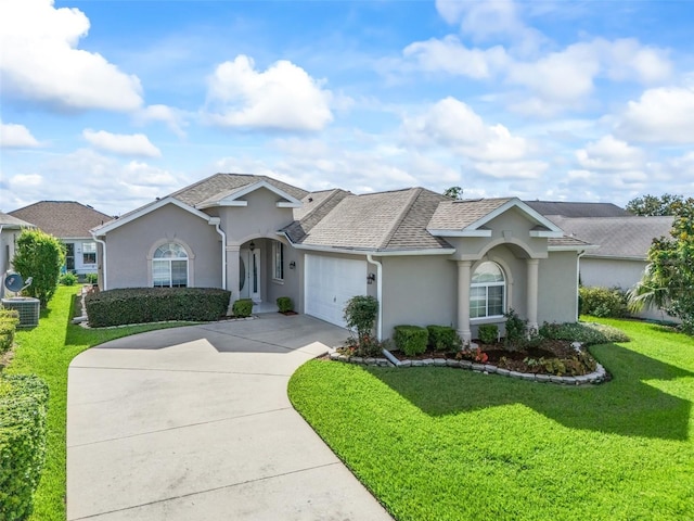 single story home featuring cooling unit, a front lawn, and a garage