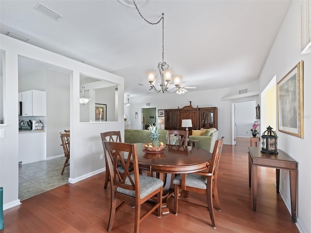 dining room with a notable chandelier and hardwood / wood-style flooring