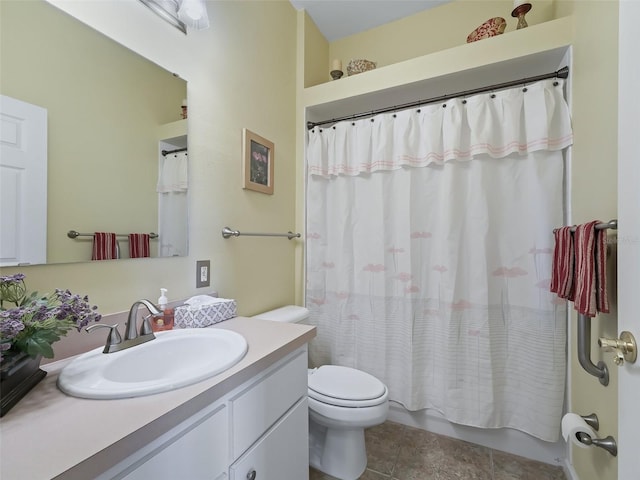 bathroom featuring vanity, toilet, and tile patterned floors