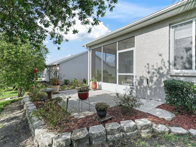 exterior space featuring a sunroom