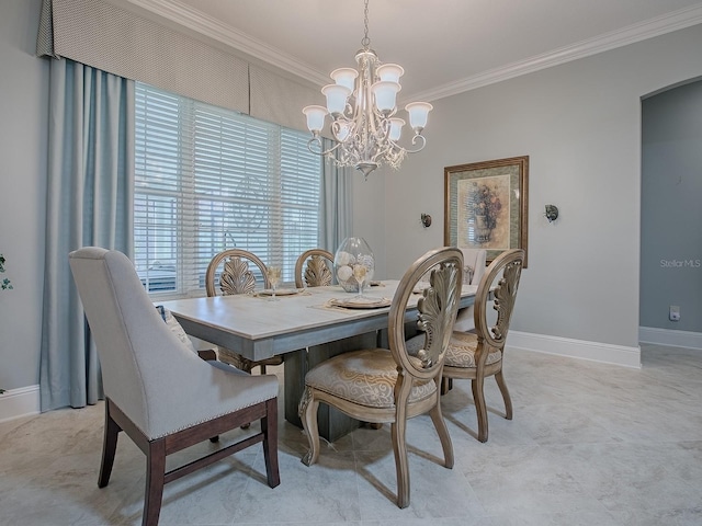 dining area featuring ornamental molding and a chandelier