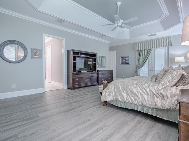 bedroom featuring ornamental molding, hardwood / wood-style flooring, and ceiling fan