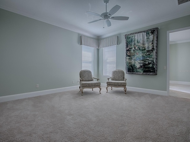 unfurnished room featuring crown molding, light colored carpet, and ceiling fan